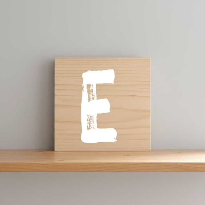 Rustic monogram letter E on natural distressed wood wall hanging, personalized nursery decor for shelf, dresser, and kids bedroom by Presto Chango Decor