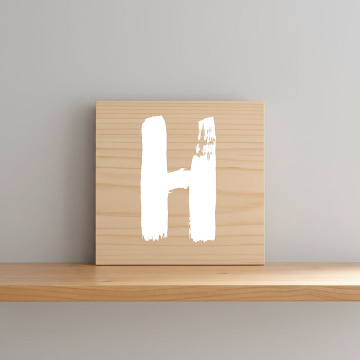 Rustic monogram letter H on natural distressed wood wall hanging, personalized nursery decor for shelf, dresser, and kids bedroom by Presto Chango Decor