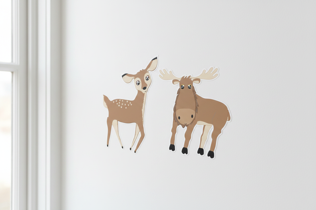 Cute cartoon deer and moose wall decals close-up on white nursery wall — woodland forest animal peel and stick stickers