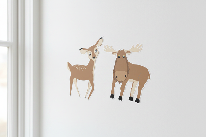Cute cartoon deer and moose wall decals close-up on white nursery wall — woodland forest animal peel and stick stickers