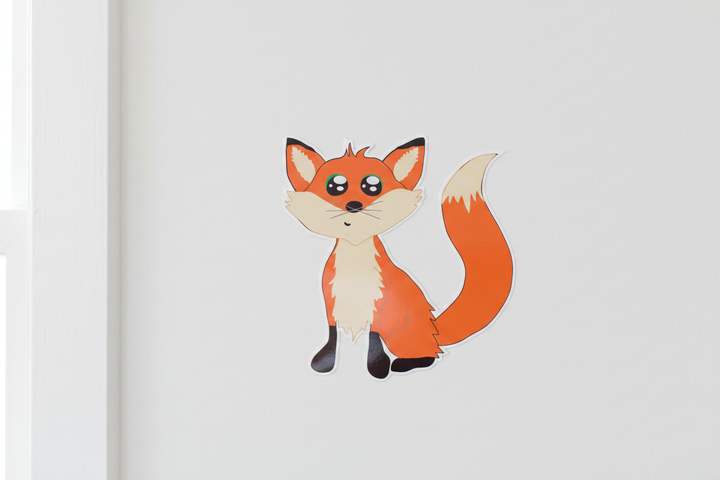 Cute cartoon orange fox wall decal close-up on white nursery wall — woodland forest animal peel and stick sticker