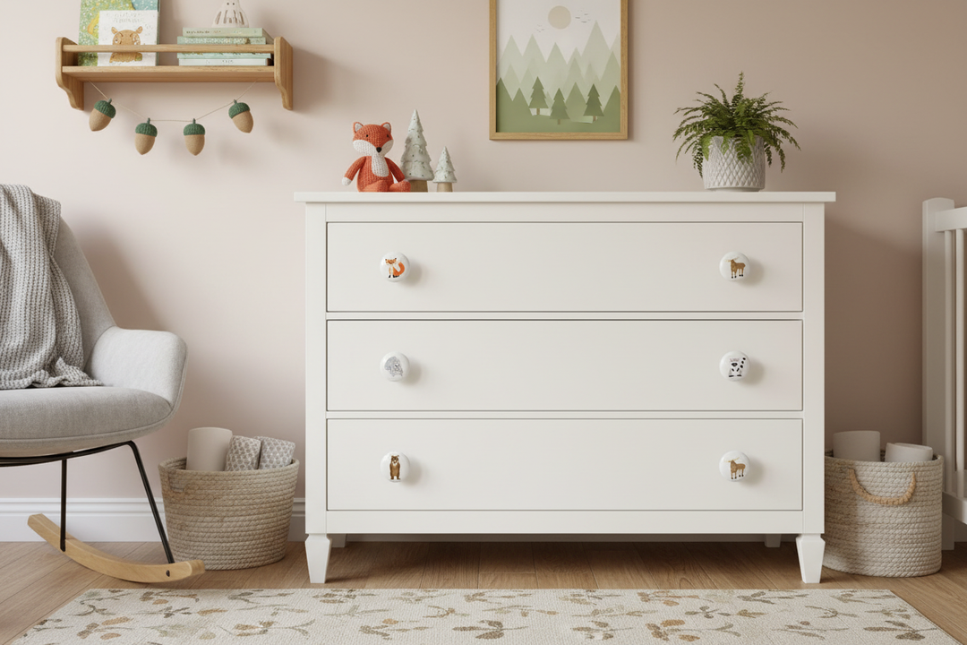 Woodland forest animal ceramic drawer knobs installed on white nursery dresser drawers