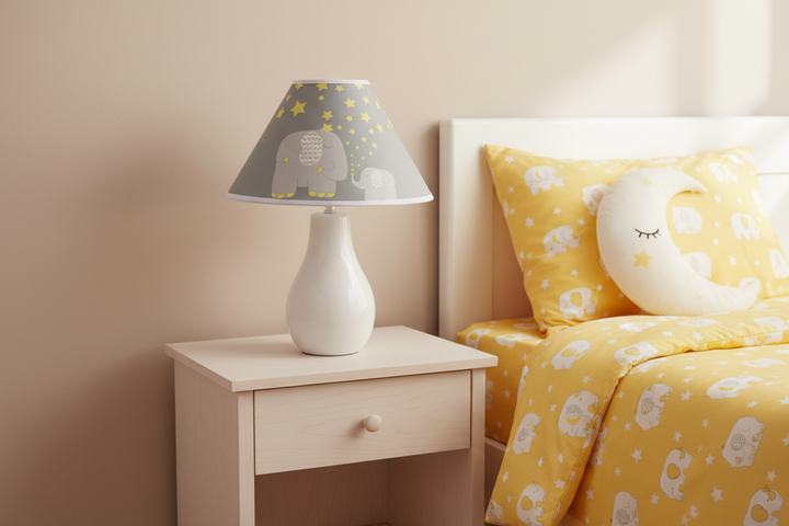 Yellow Elephant Lamp Shade on nightstand against simple wall in yellow elephant nursery