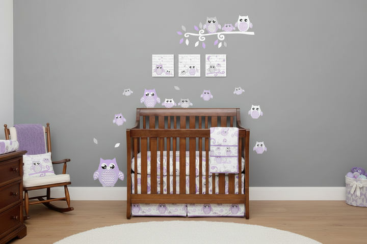 Three woodland owl canvas prints displayed above wooden crib with purple owl bedding and coordinating purple owl wall decals in styled nursery room