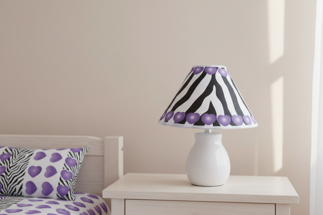 Purple Hearts Zebra Print Lamp Shade on nightstand against simple wall in purple zebra girls nursery
