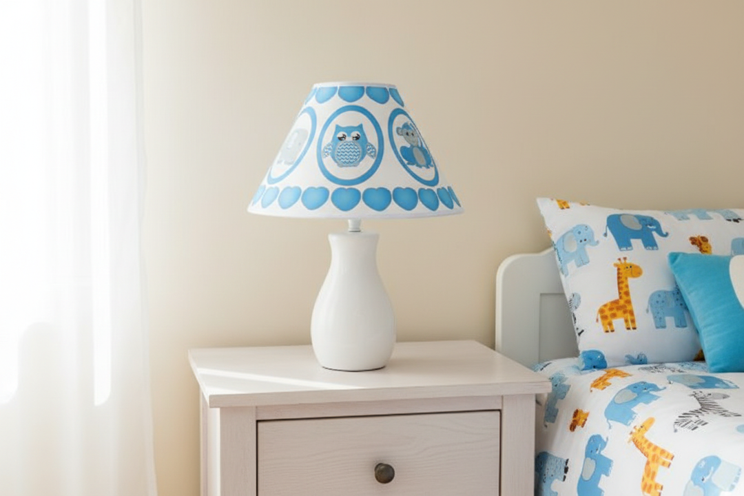 Blue Baby Safari Lamp Shade on nightstand against simple wall in blue safari nursery